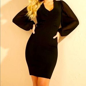 Gemma Sweater Dress in jet black from the Marciano Collection. Size Small. NWT